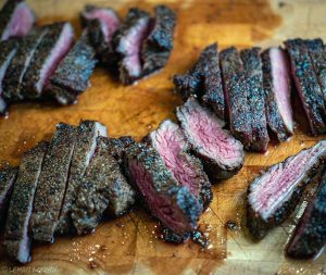 Entrecote tagliata with roasted garlic sriracha arugula parmesan