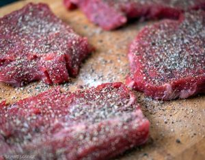 Entrecote tagliata with roasted garlic sriracha arugula parmesan