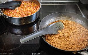 Shakshuka with minced beef egg bacon aromatic cheese