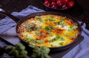 Shakshuka with minced beef egg bacon aromatic cheese