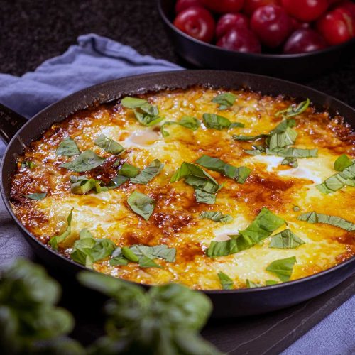 Shakshuka with minced beef egg bacon aromatic cheese